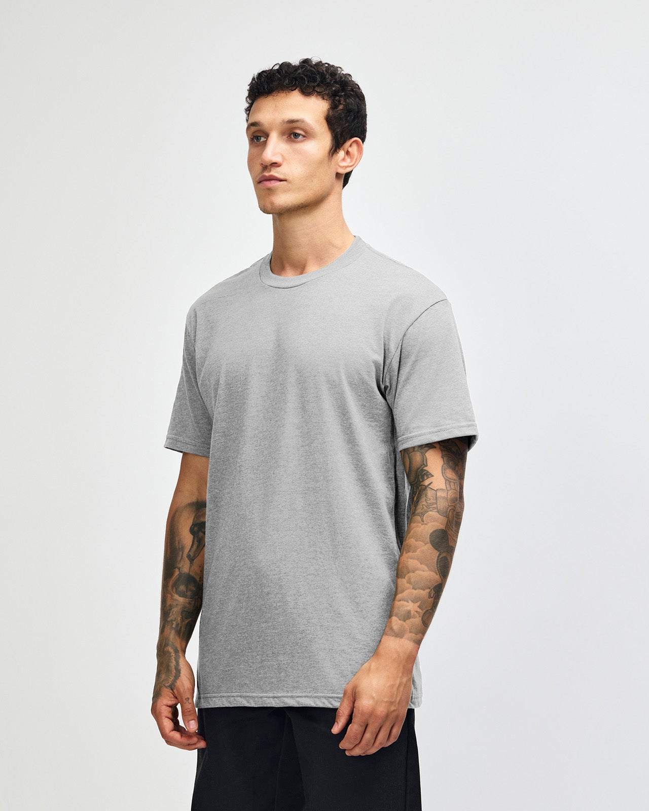 Male model wearing heather grey colour CVC Unisex Short Sleeve Crew Neck Tee (front pose) -heather grey