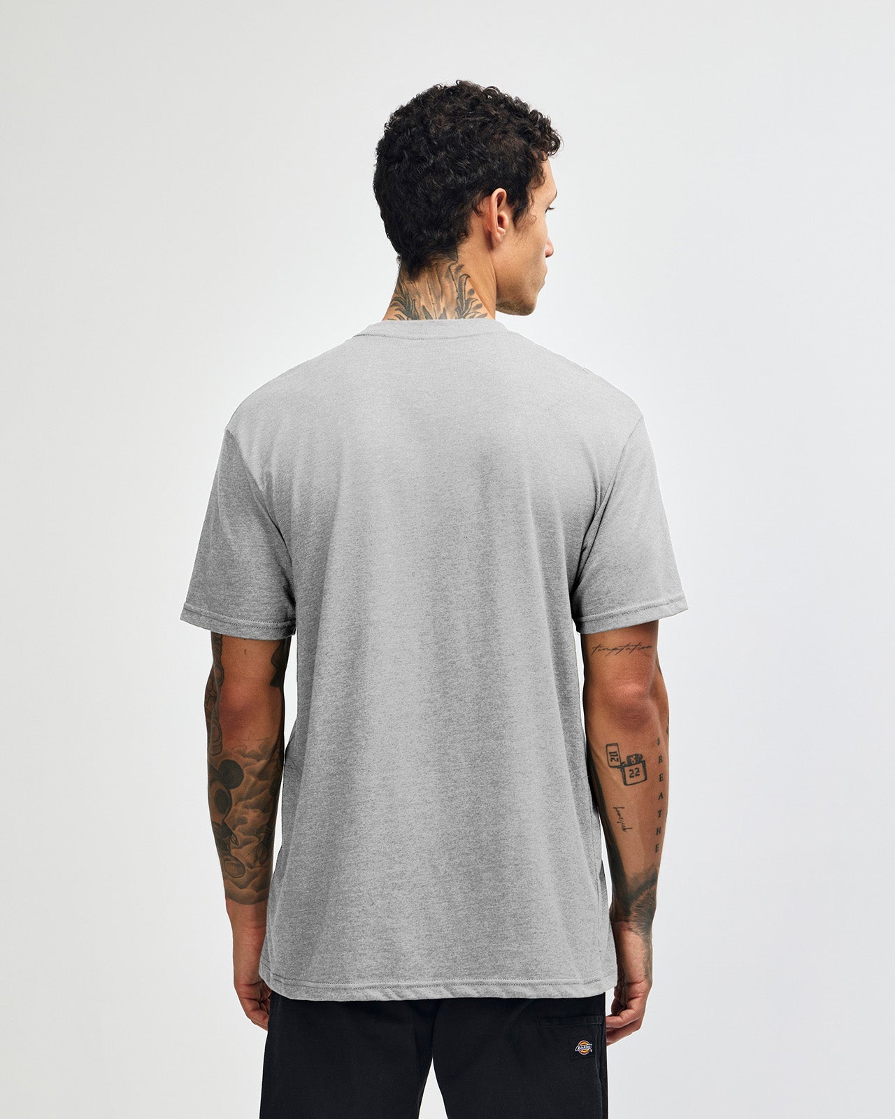 Male model wearing heather grey colour CVC Unisex Short Sleeve Crew Neck Tee (back pose) -heather grey