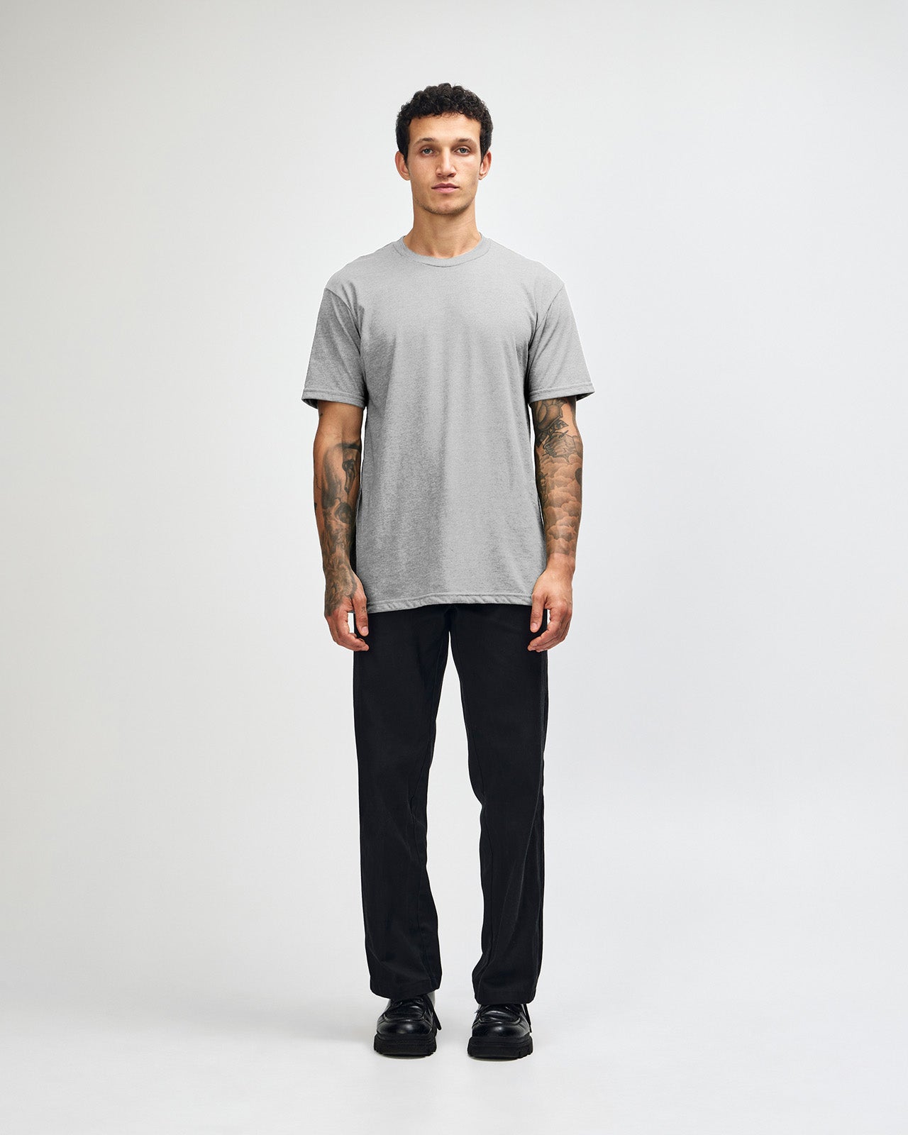Male model wearing heather grey colour CVC Unisex Short Sleeve Crew Neck Tee (front pose) -heather grey