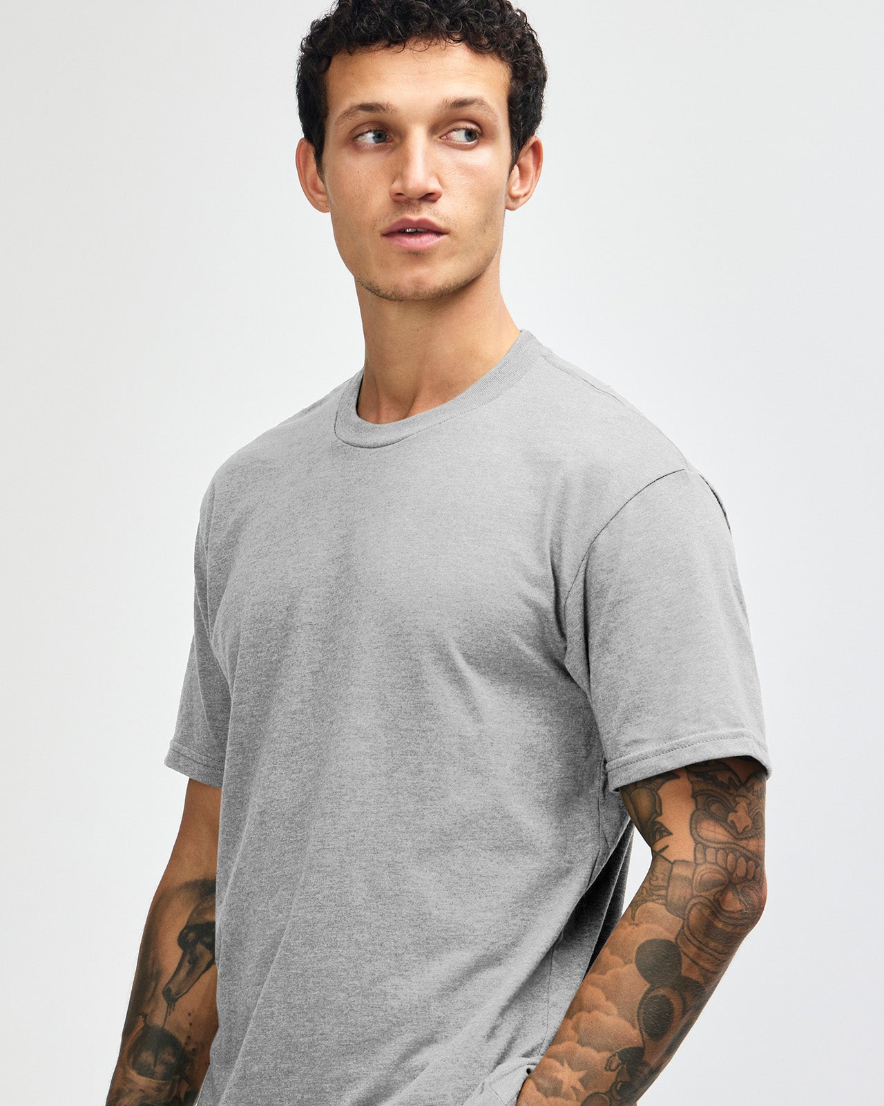 Male model wearing heather grey colour CVC Unisex Short Sleeve Crew Neck Tee (front pose) -heather grey