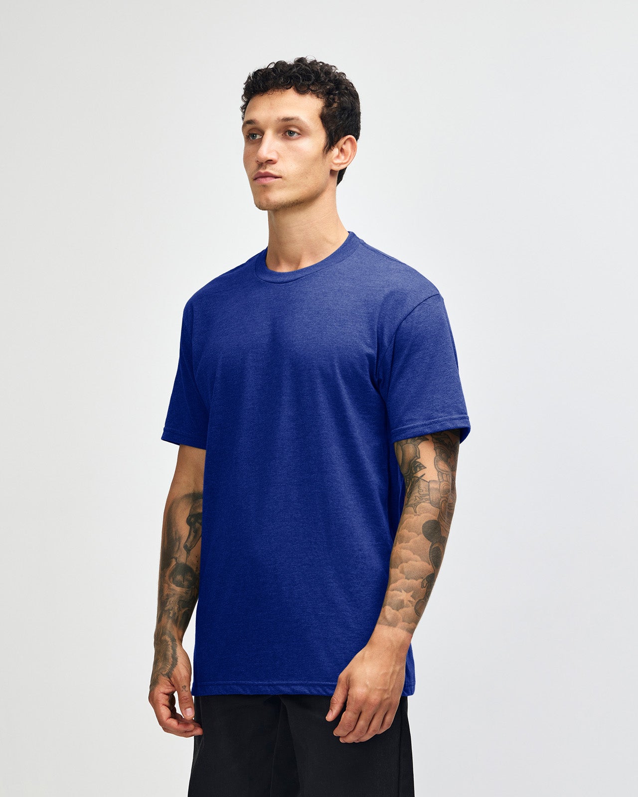 Male model wearing heather lapis colour CVC Unisex Short Sleeve Crew Neck Tee (front pose) -heather lapis