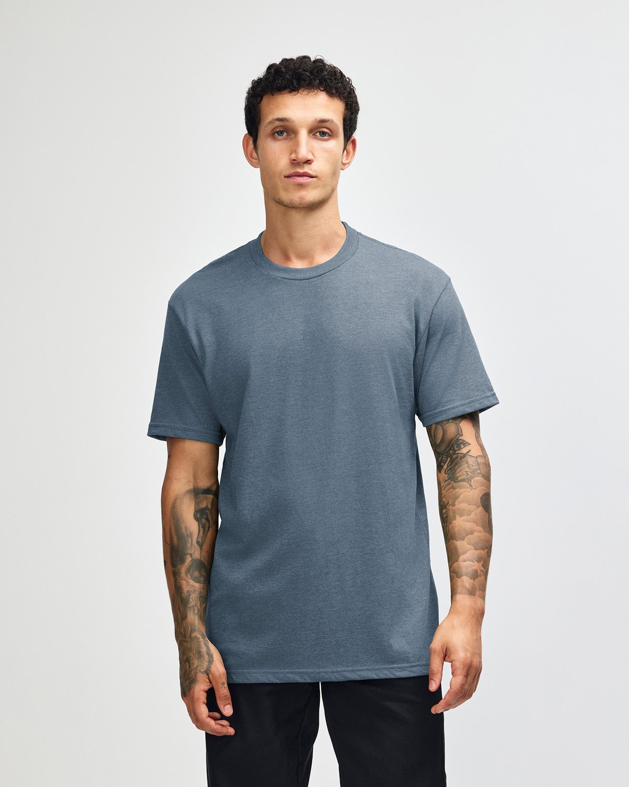 Male model wearing heather navy colour CVC Unisex Short Sleeve Crew Neck Tee (front pose) -heather navy