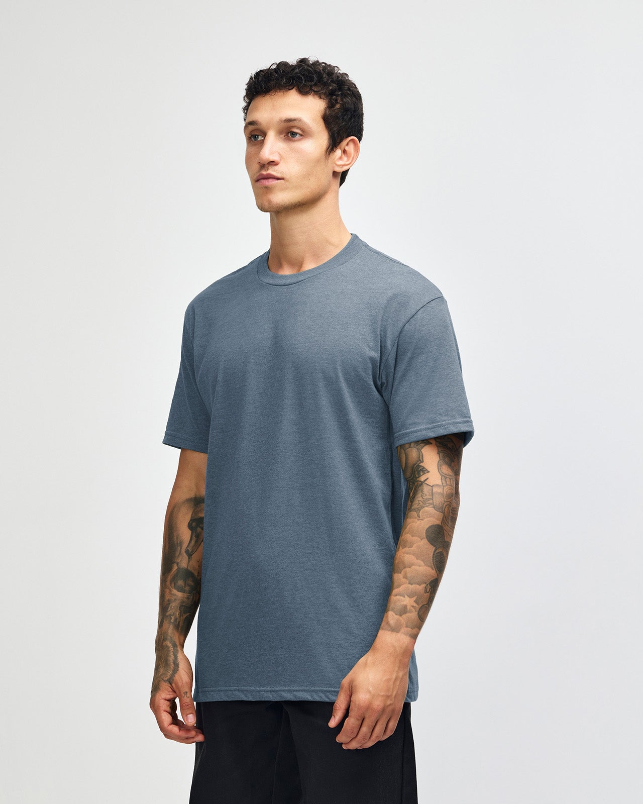 Male model wearing heather navy colour CVC Unisex Short Sleeve Crew Neck Tee (front pose) -heather navy