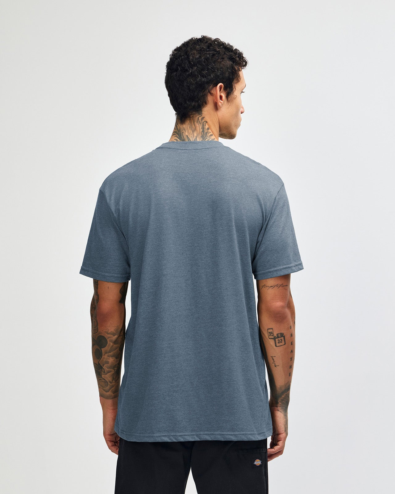 Male model wearing heather navy colour CVC Unisex Short Sleeve Crew Neck Tee (front pose) -heather navy
