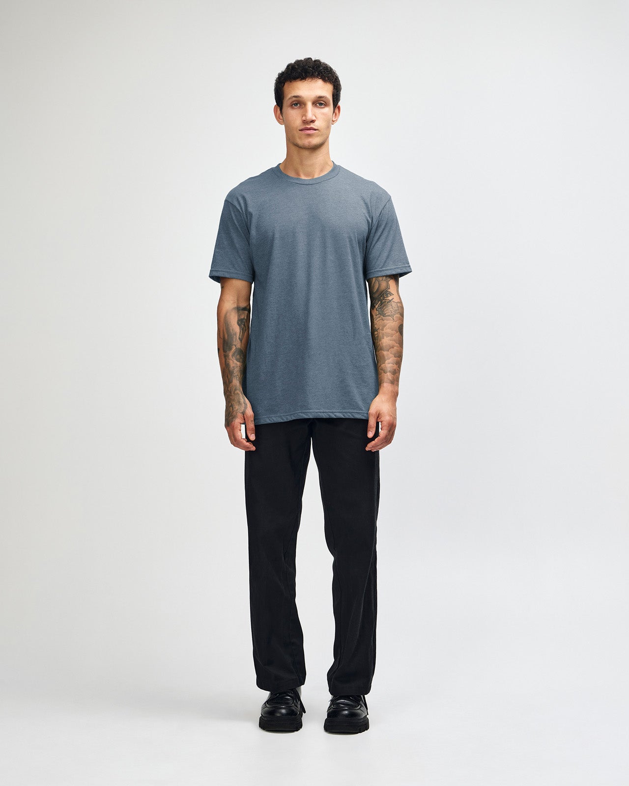 Male model wearing heather navy colour CVC Unisex Short Sleeve Crew Neck Tee (front pose) -heather navy