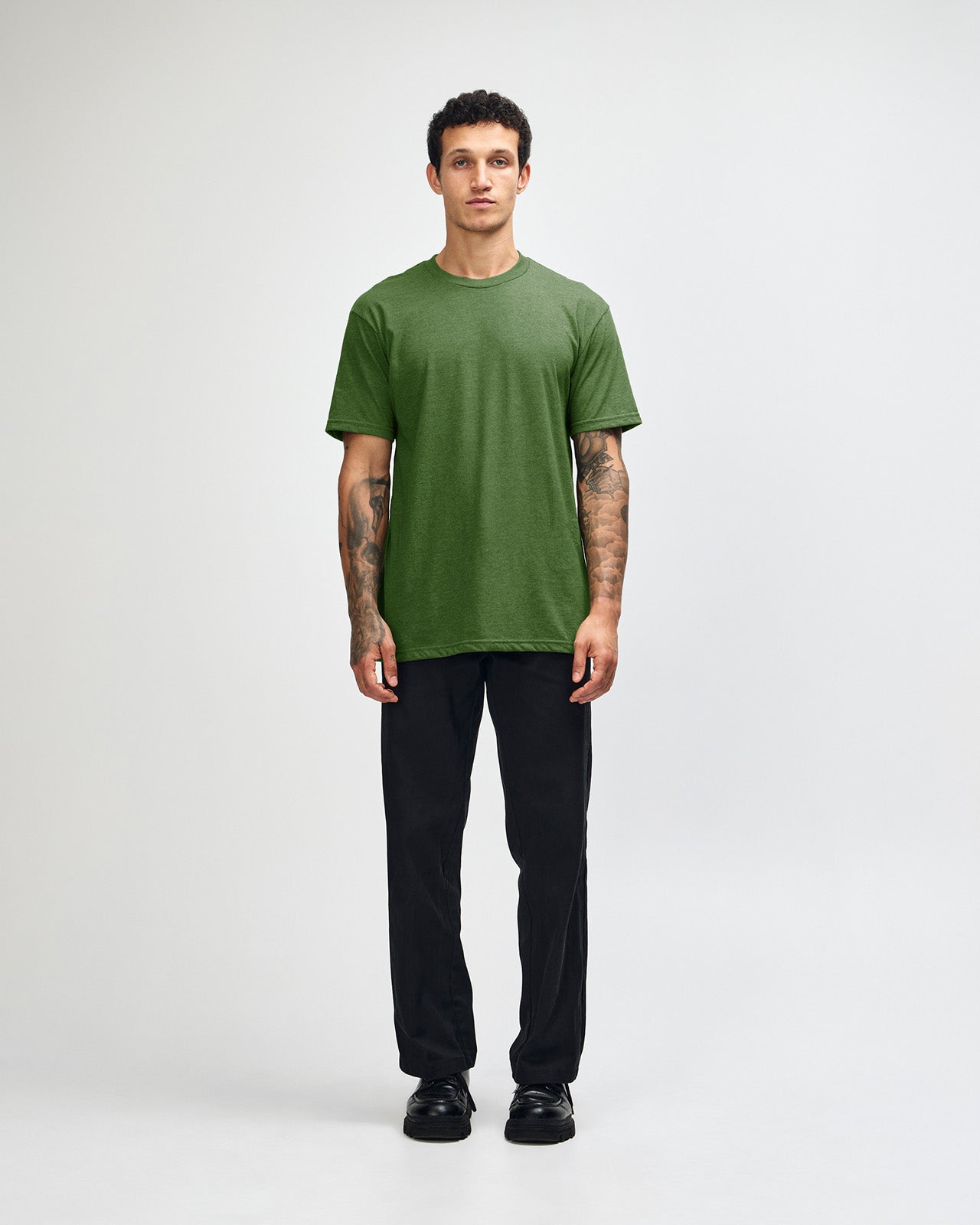 Male model wearing heather olive colour CVC Unisex Short Sleeve Crew Neck Tee (front pose) -heather olive