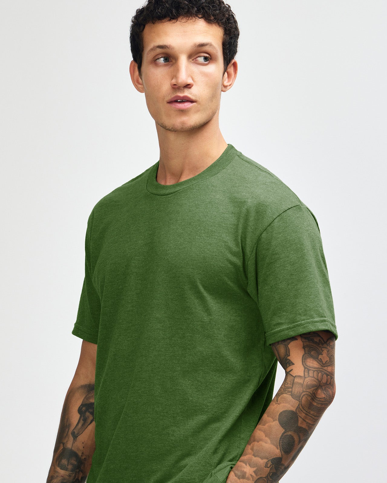 Male model wearing heather olive colour CVC Unisex Short Sleeve Crew Neck Tee (front pose) -heather olive