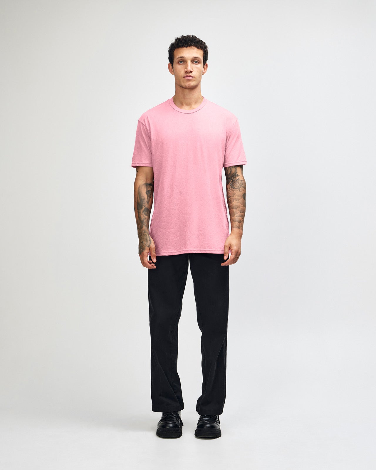 Male model wearing heather pink colour CVC Unisex Short Sleeve Crew Neck Tee (front pose) -heather pink