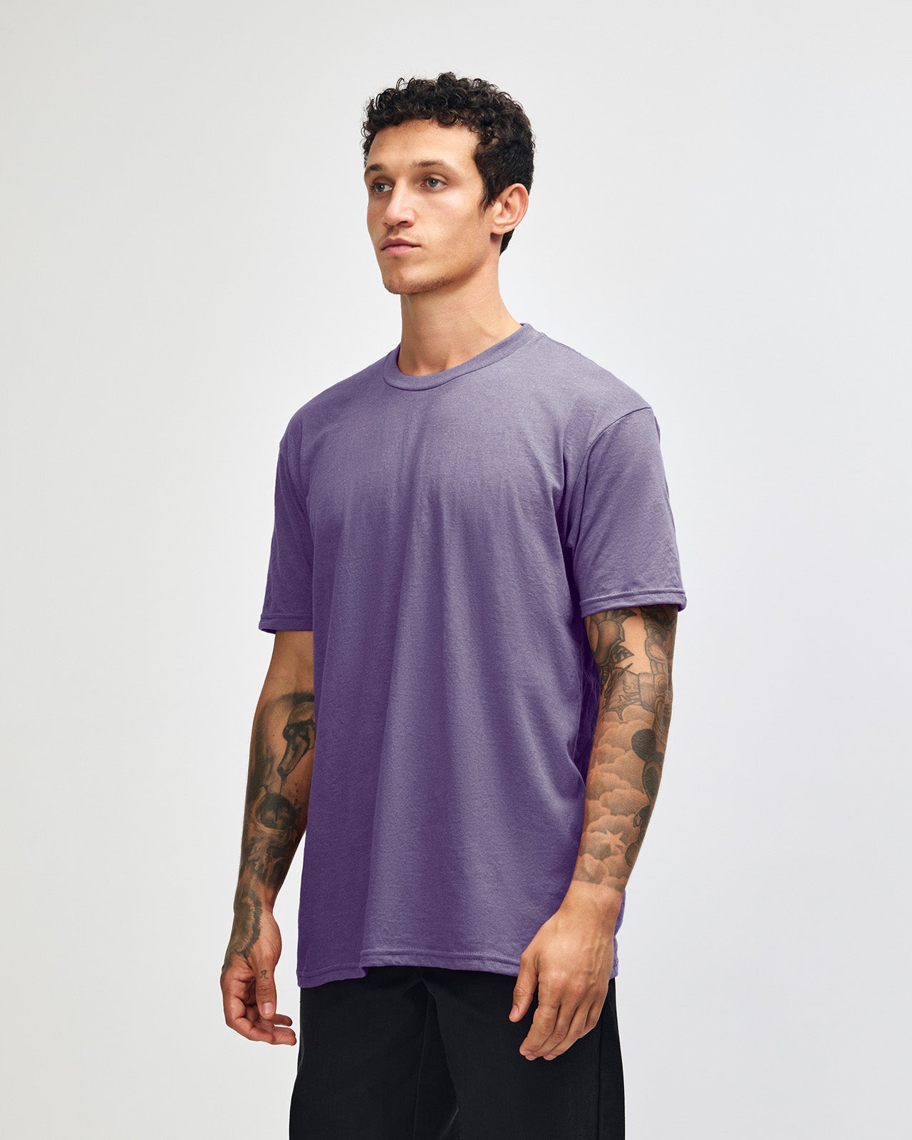 Male model wearing heather purple colour CVC Unisex Short Sleeve Crew Neck Tee (front pose) -heather purple