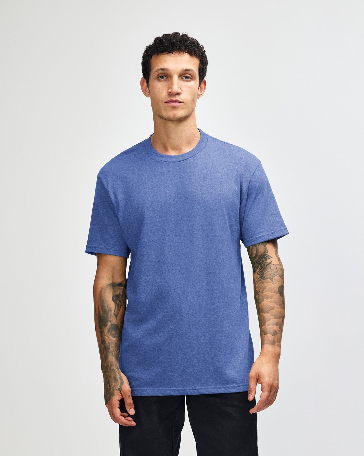 Male model wearing heather Royal Blue colour CVC Unisex Short Sleeve Crew Neck Tee (front pose) -heather royal blue