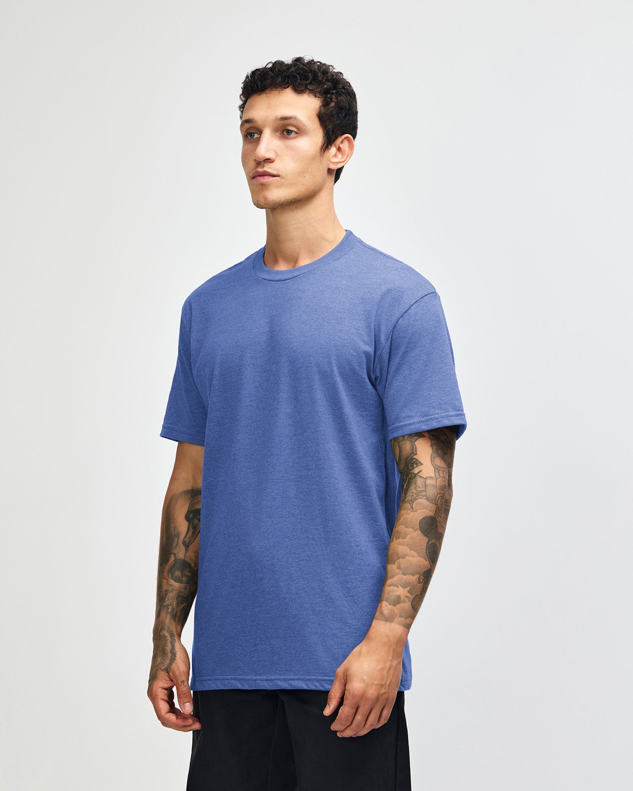 Male model wearing heather Royal Blue colour CVC Unisex Short Sleeve Crew Neck Tee (front pose) -heather royal blue