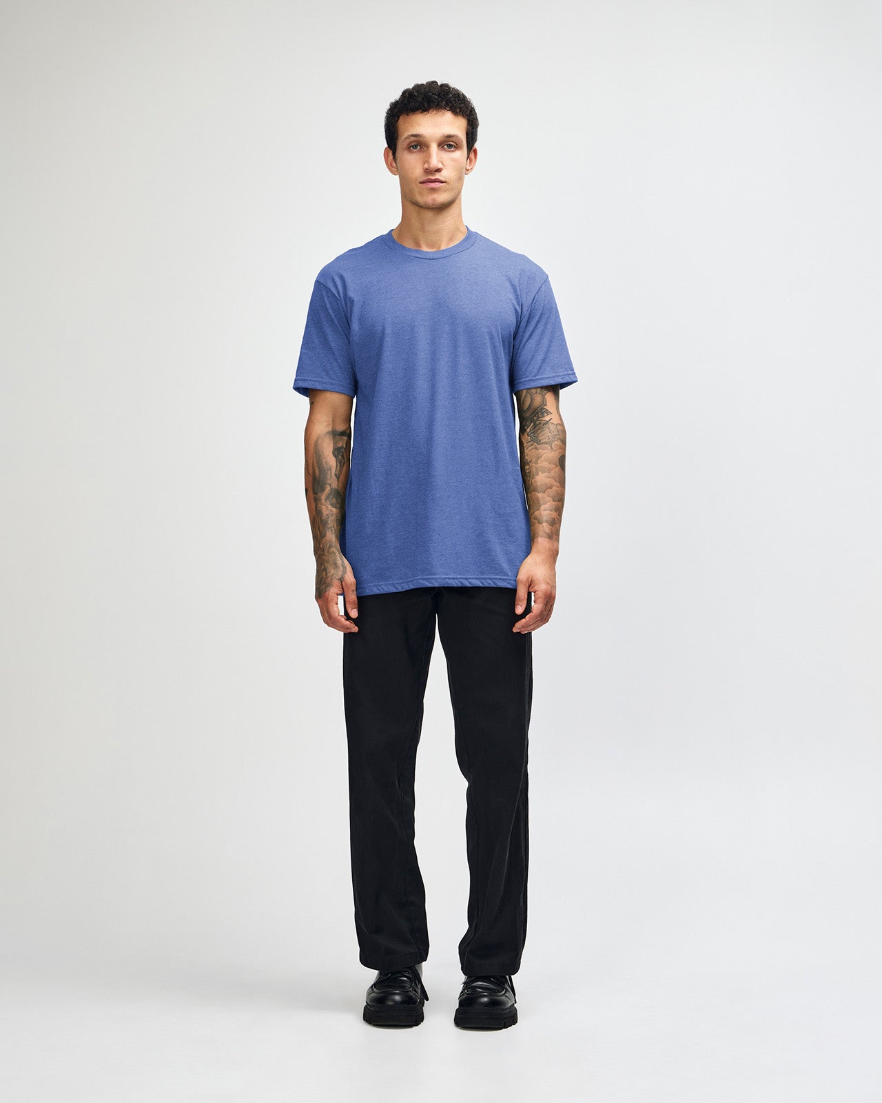 Male model wearing heather Royal Blue colour CVC Unisex Short Sleeve Crew Neck Tee (front pose) -heather royal blue