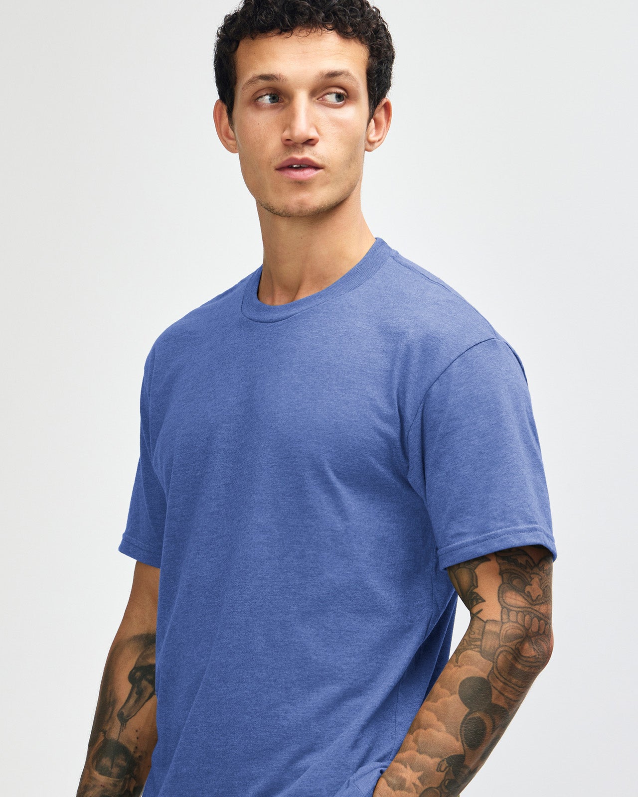 Male model wearing heather Royal Blue colour CVC Unisex Short Sleeve Crew Neck Tee (front pose) -heather royal blue