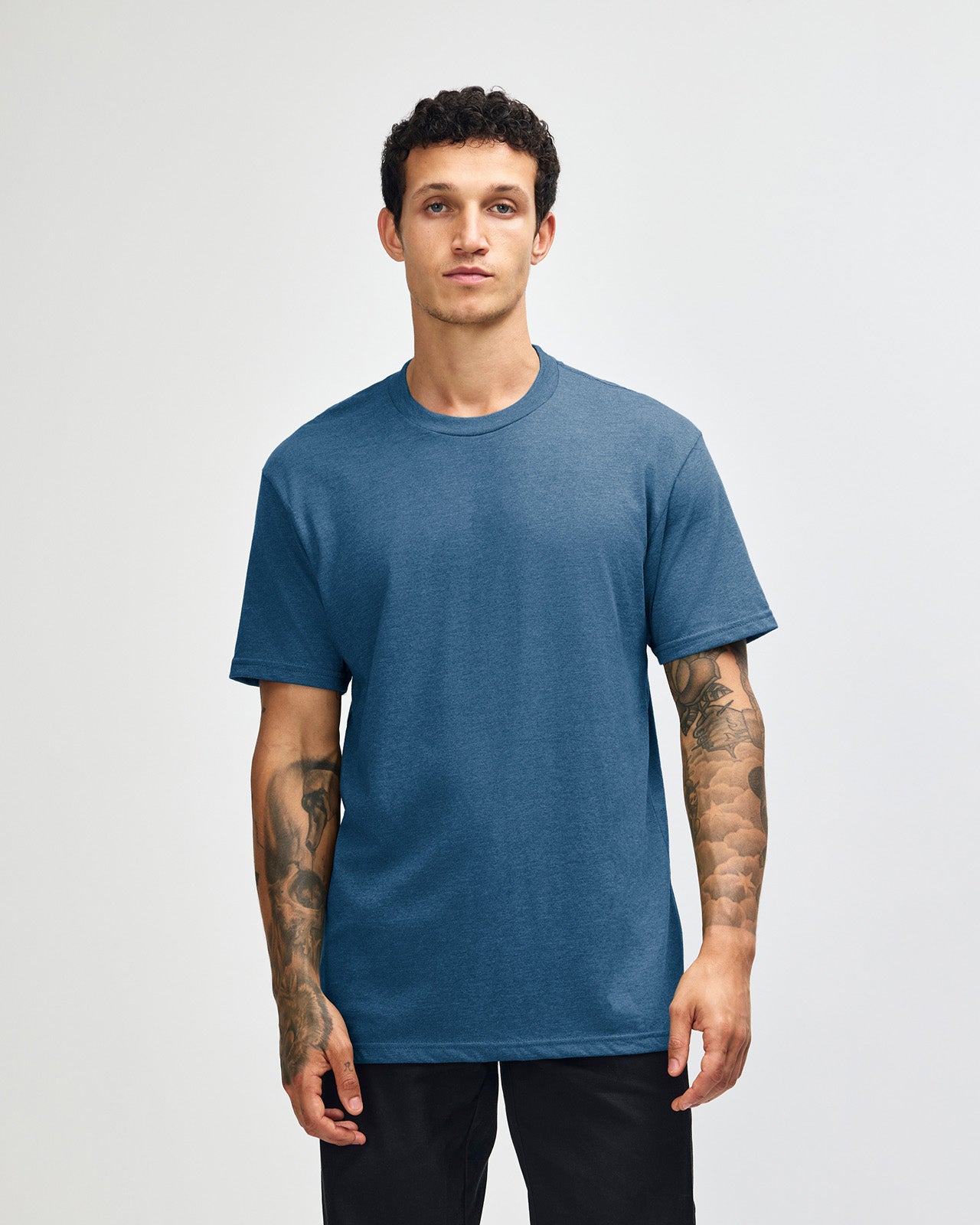 Male model wearing heather sea blue colour CVC Unisex Short Sleeve Crew Neck Tee (front pose) -heather sea blue