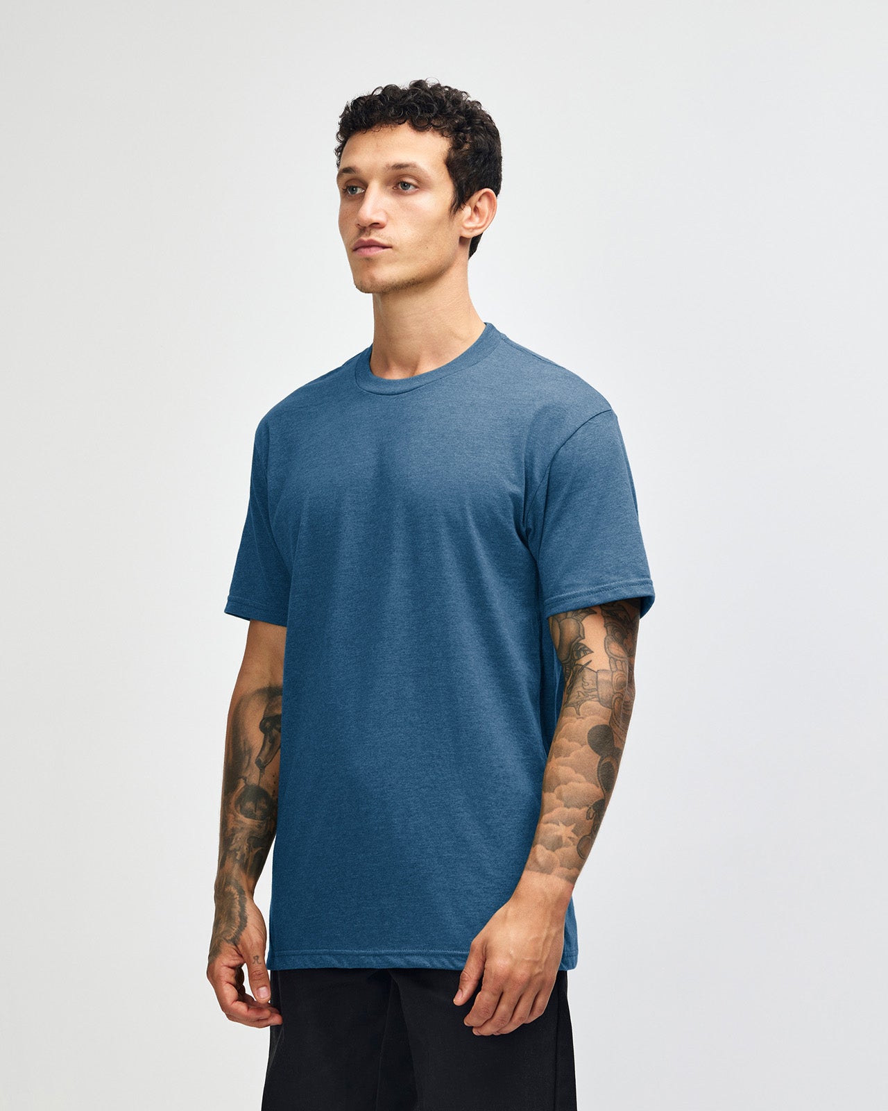 Male model wearing heather sea blue colour CVC Unisex Short Sleeve Crew Neck Tee (front pose) -heather sea blue