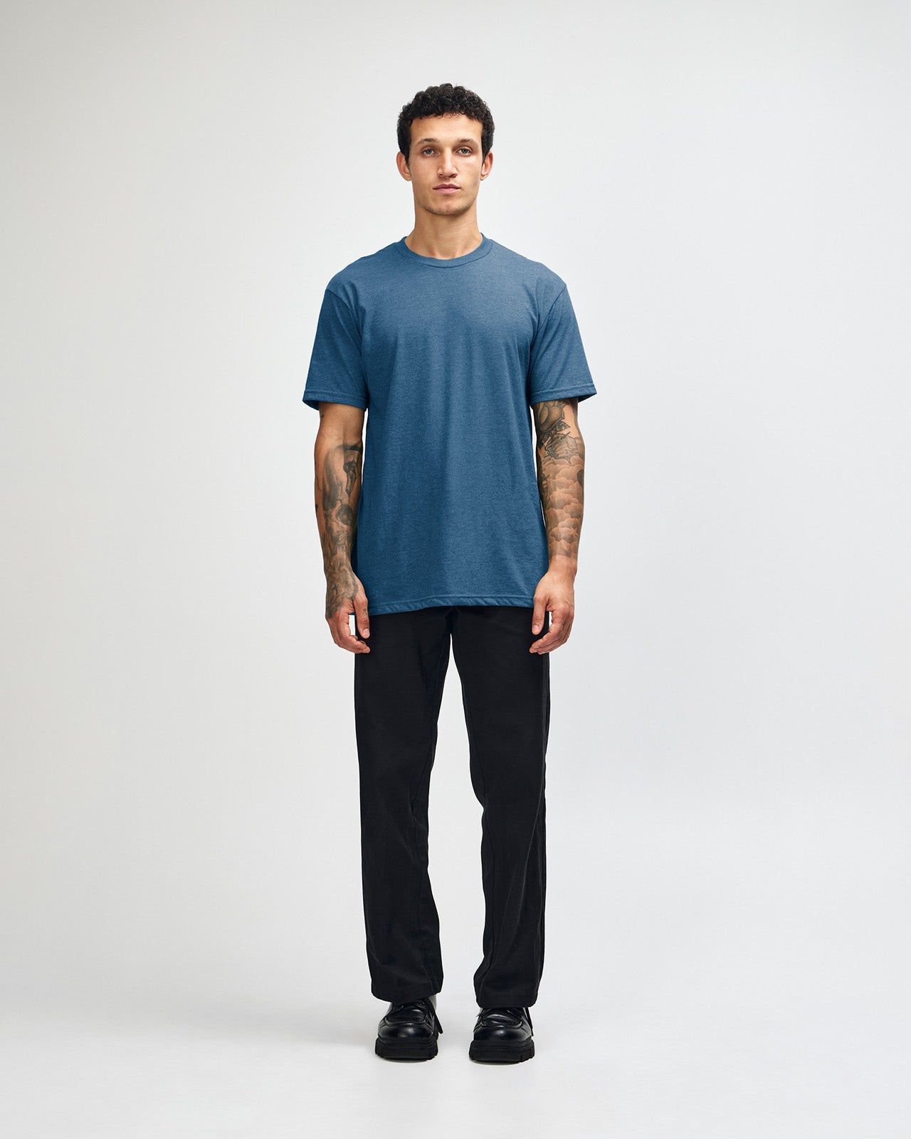 Male model wearing heather sea blue colour CVC Unisex Short Sleeve Crew Neck Tee (front pose) -heather sea blue