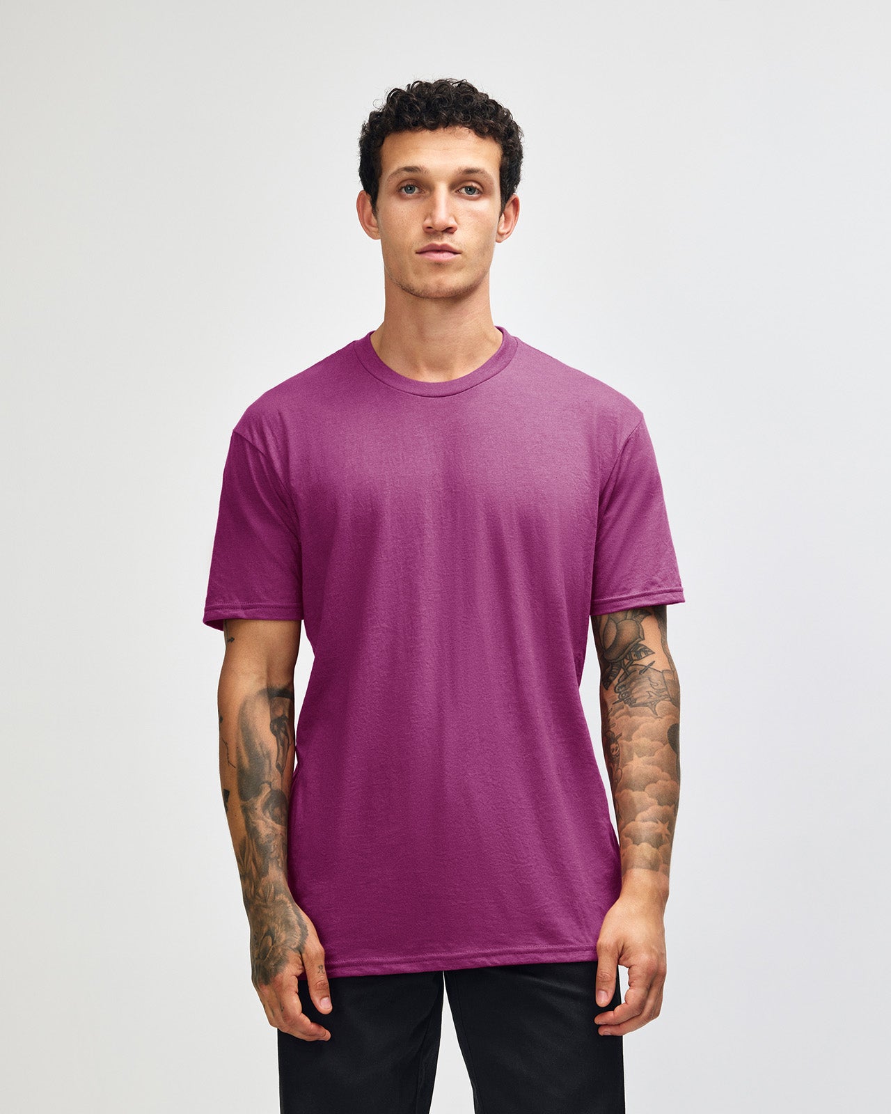Male model wearing super pink colour CVC Unisex Short Sleeve Crew Neck Tee (front pose) -super pink