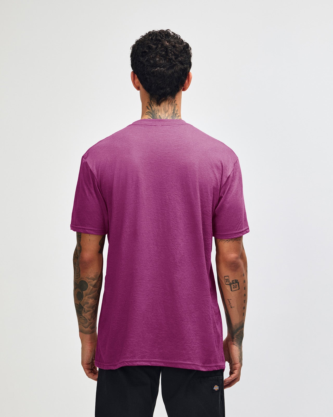 Male model wearing super pink colour CVC Unisex Short Sleeve Crew Neck Tee (back pose) -super pink