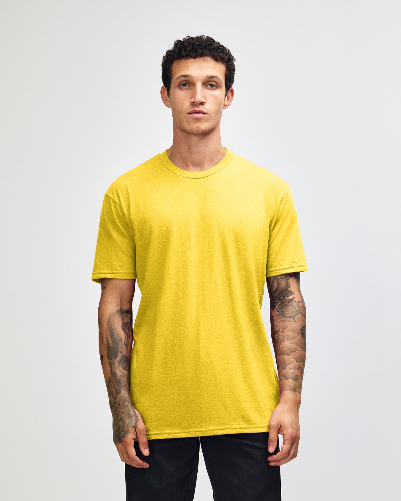 Male model wearing heather yellow colour CVC Unisex Short Sleeve Crew Neck Tee (front pose) -heather yellow
