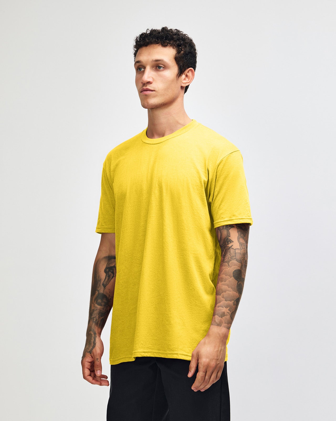 Male model wearing heather yellow colour CVC Unisex Short Sleeve Crew Neck Tee (front pose) -heather yellow