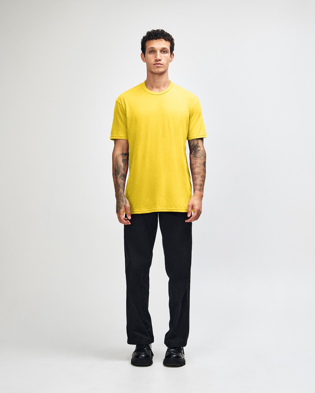 Male model wearing heather yellow colour CVC Unisex Short Sleeve Crew Neck Tee (front pose) -heather yellow