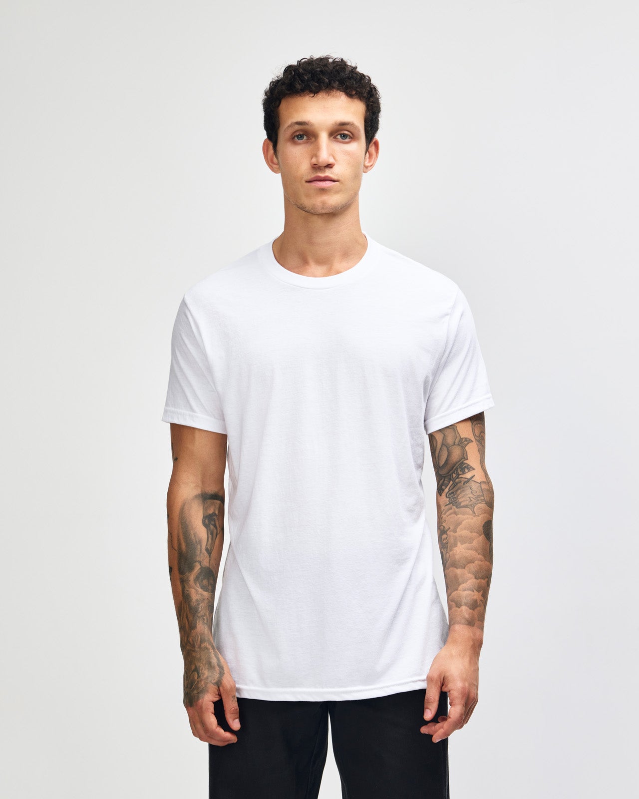 Male model wearing white colour CVC Unisex Short Sleeve Crew Neck Tee (front pose) -white