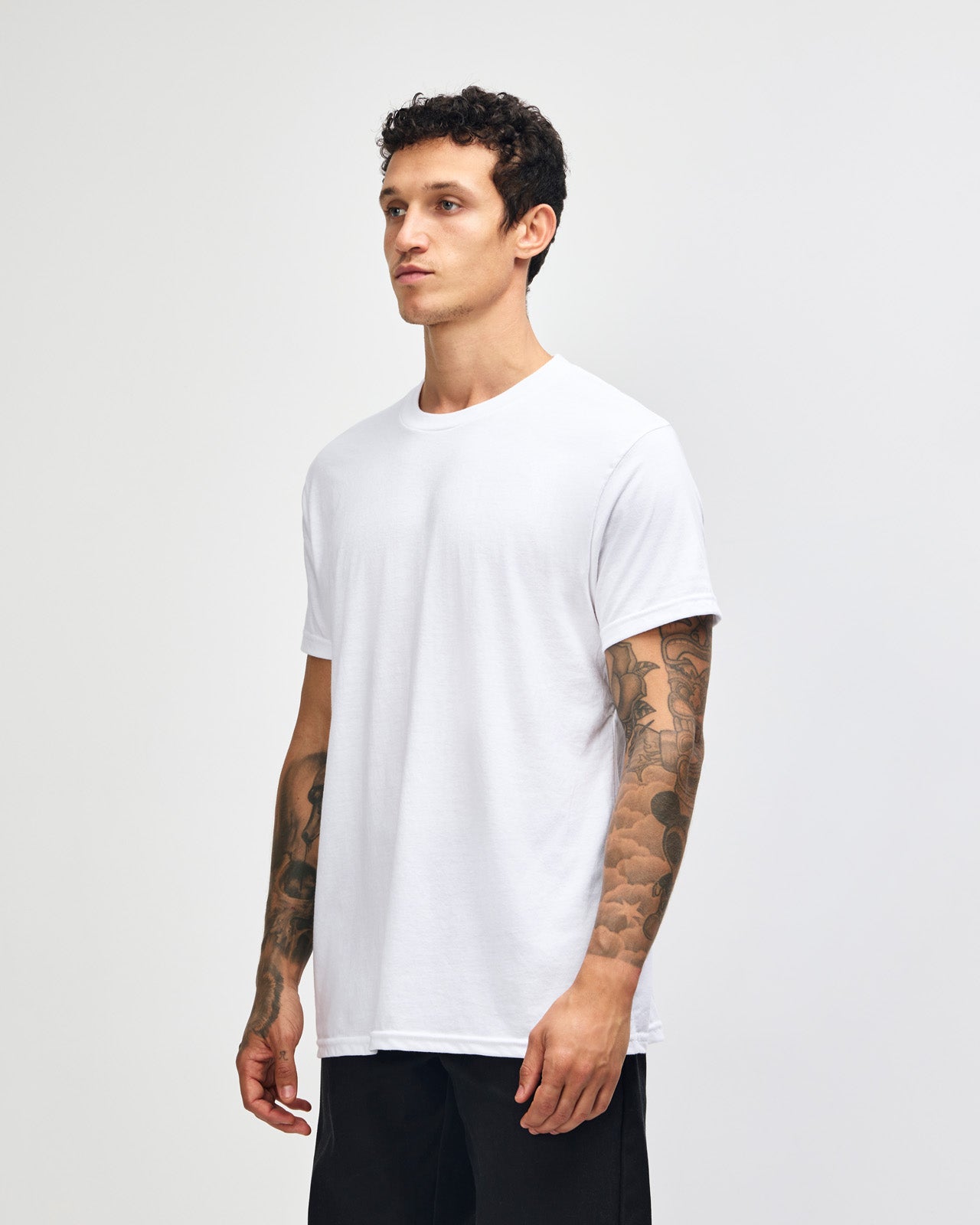 Male model wearing white colour CVC Unisex Short Sleeve Crew Neck Tee (front pose) -white