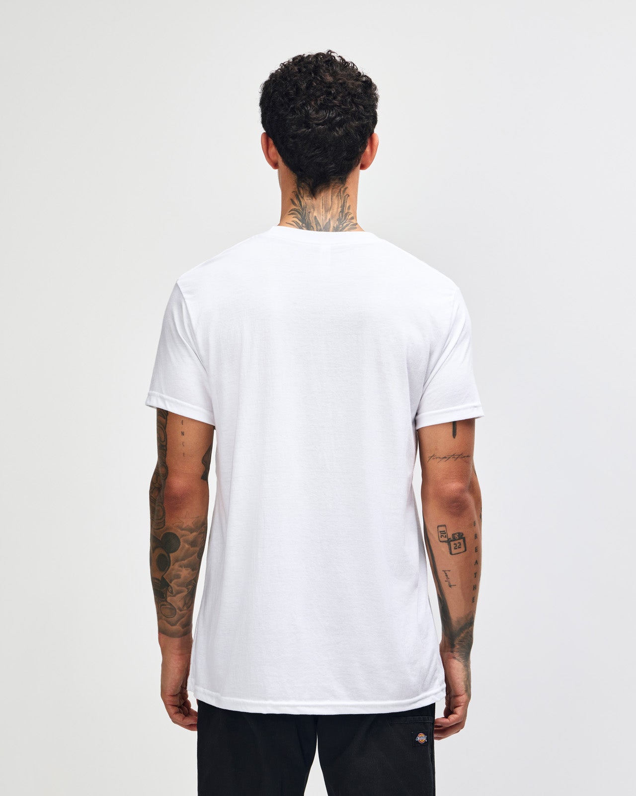Male model wearing white colour CVC Unisex Short Sleeve Crew Neck Tee (back pose) -white