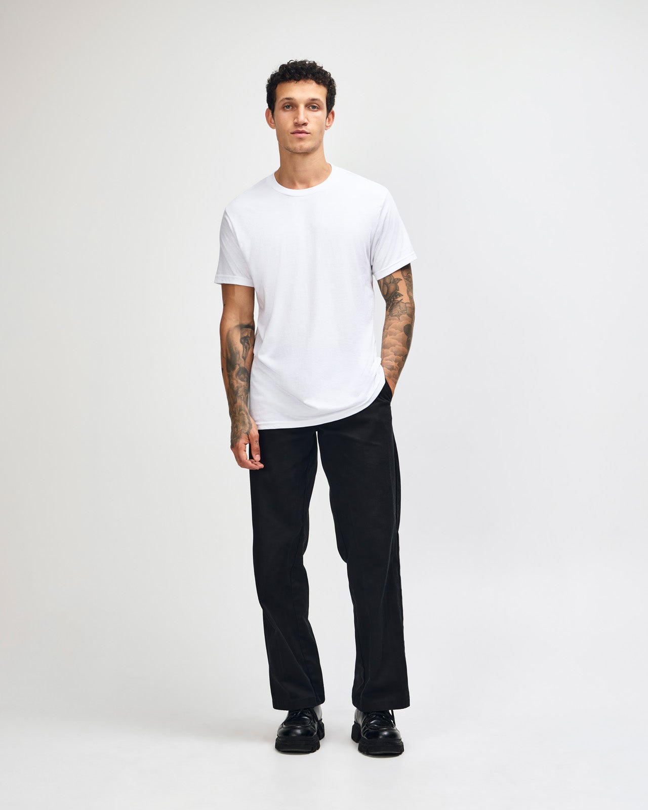 Male model wearing white colour CVC Unisex Short Sleeve Crew Neck Tee (front pose) -white
