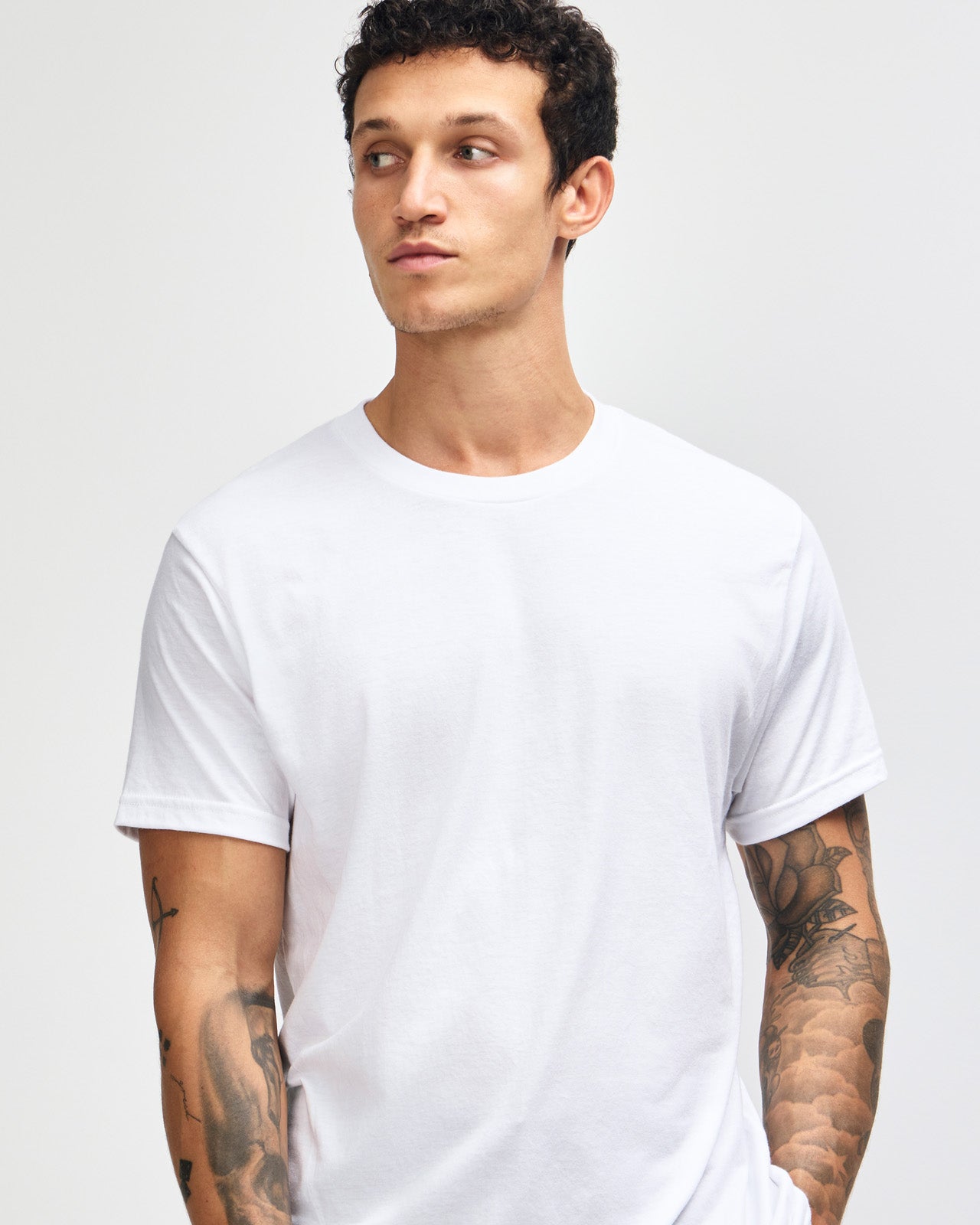 Male model wearing white colour CVC Unisex Short Sleeve Crew Neck Tee (front pose) -white