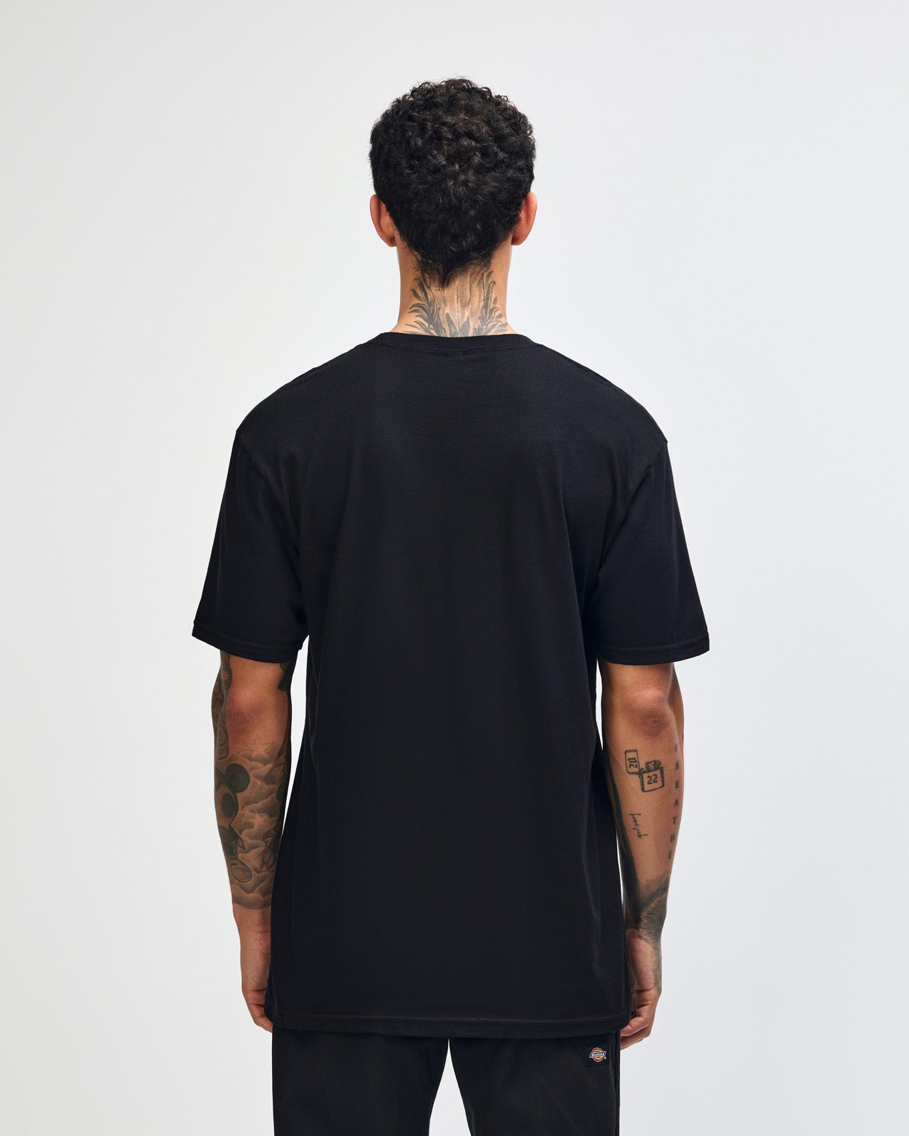 Fine Jersey Male mode wearing black colour American Apparel Unisex Short Sleeve Crew Neck Tee (back pose) -black