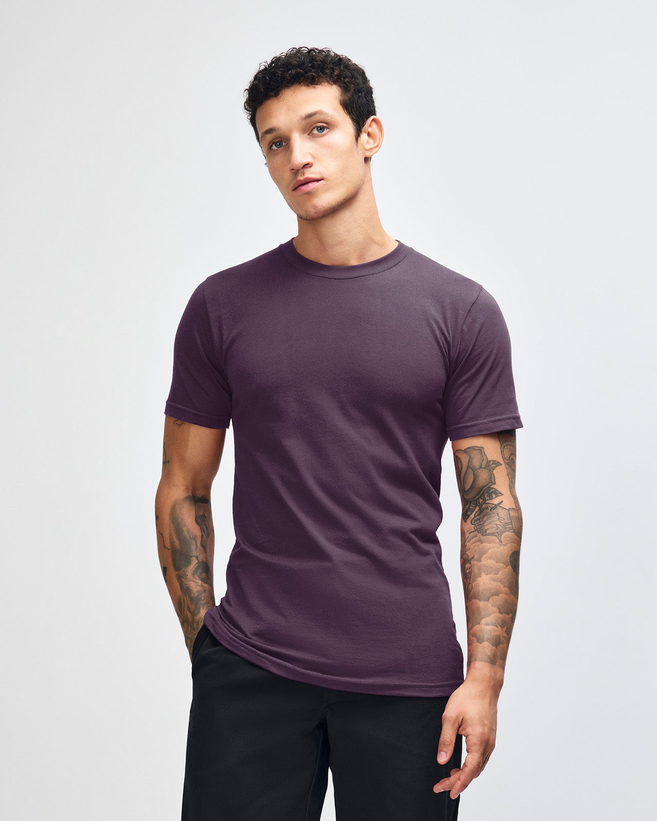 Male mode wearing eggplant colour American Apparel Fine jersey Unisex Short Sleeve Crew Neck Tee (Front pose) -eggplant