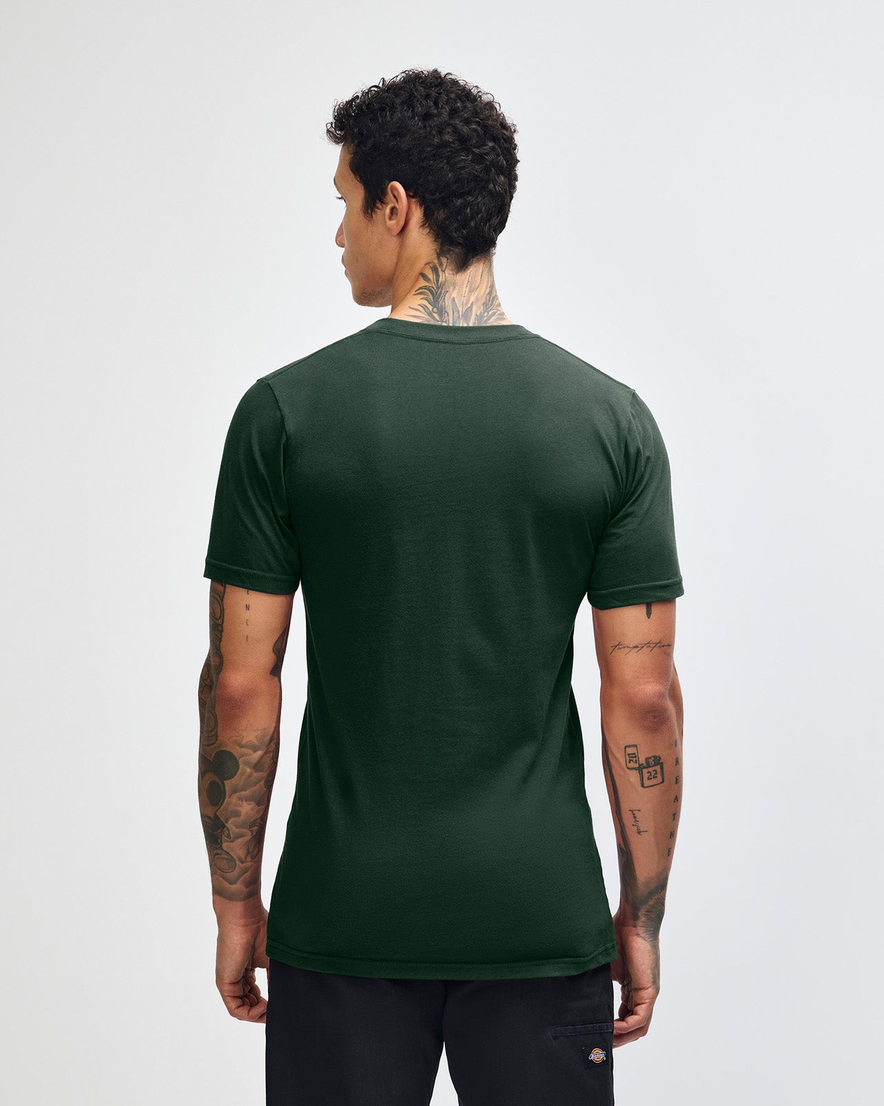 Male mode wearing forest colour American Apparel Fine jersey Unisex Short Sleeve Crew Neck Tee (back pose) -forest 