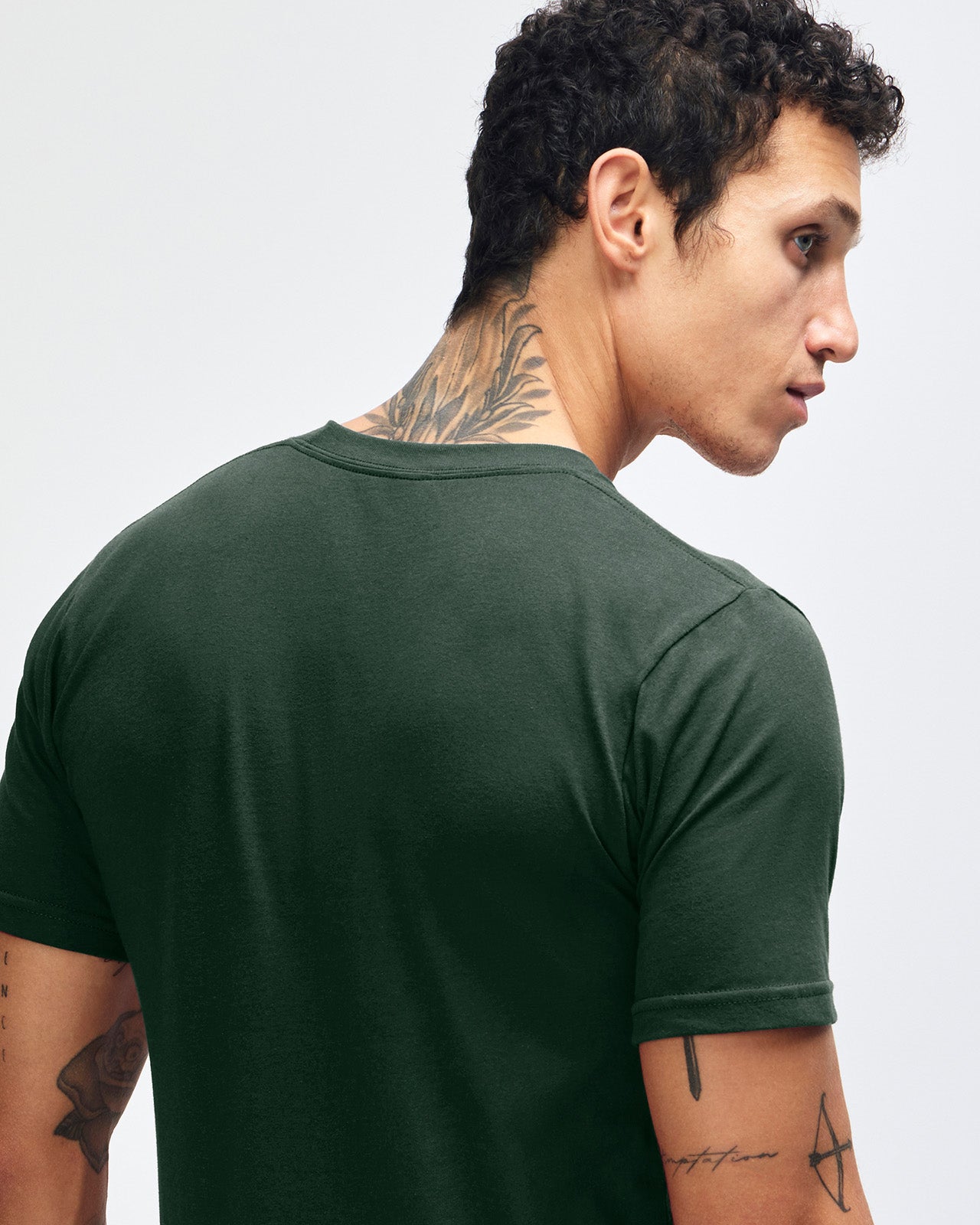 Male mode wearing forest colour American Apparel Fine jersey Unisex Short Sleeve Crew Neck Tee (back pose) -forest 