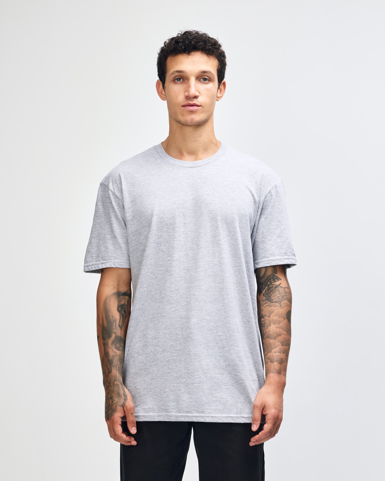 male model wearing heather grey colour Fine Jersey Unisex Crew Neck Tee (front pose) -heather grey
