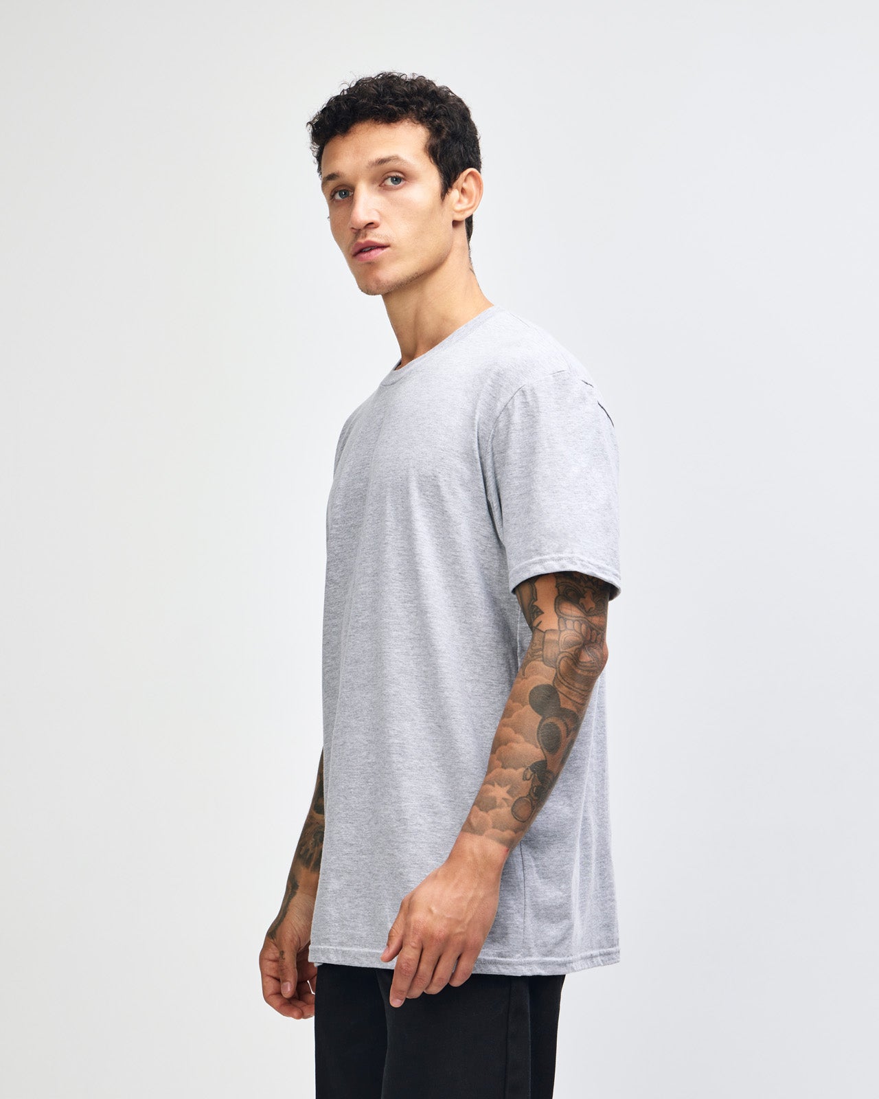 male model wearing heather grey colour Fine Jersey Unisex Crew Neck Tee (front pose) -heather grey