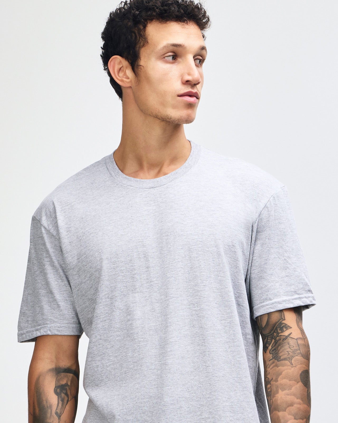 male model wearing heather grey colour Fine Jersey Unisex Crew Neck Tee (front pose) -heather grey