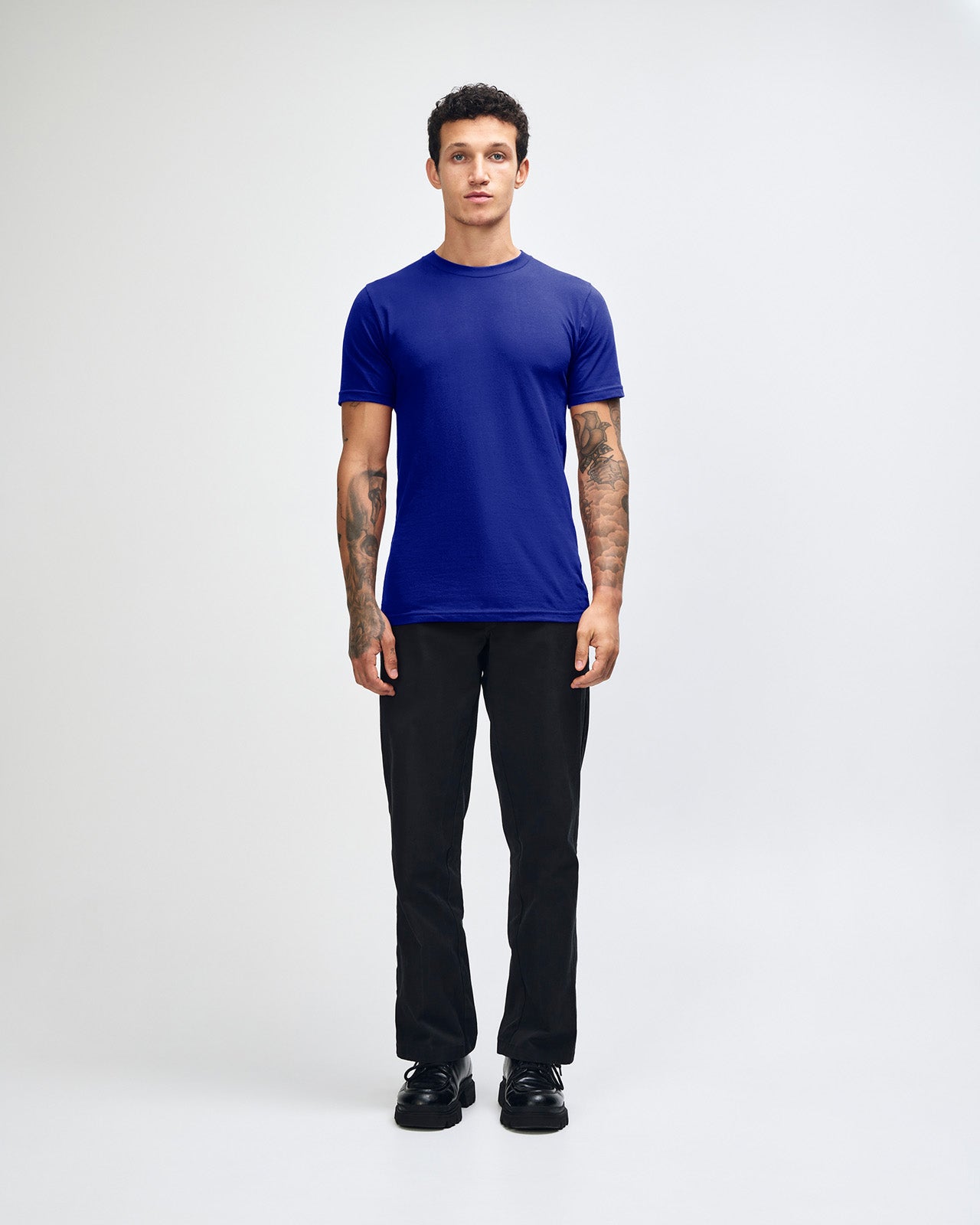 male model wearing  Lapis colour Fine Jersey Unisex Crew Neck Tee (front pose) -lapis