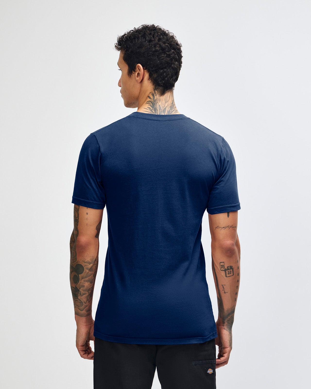 male model wearing  Navy colour Fine Jersey Unisex Crew Neck Tee (back pose) -navy