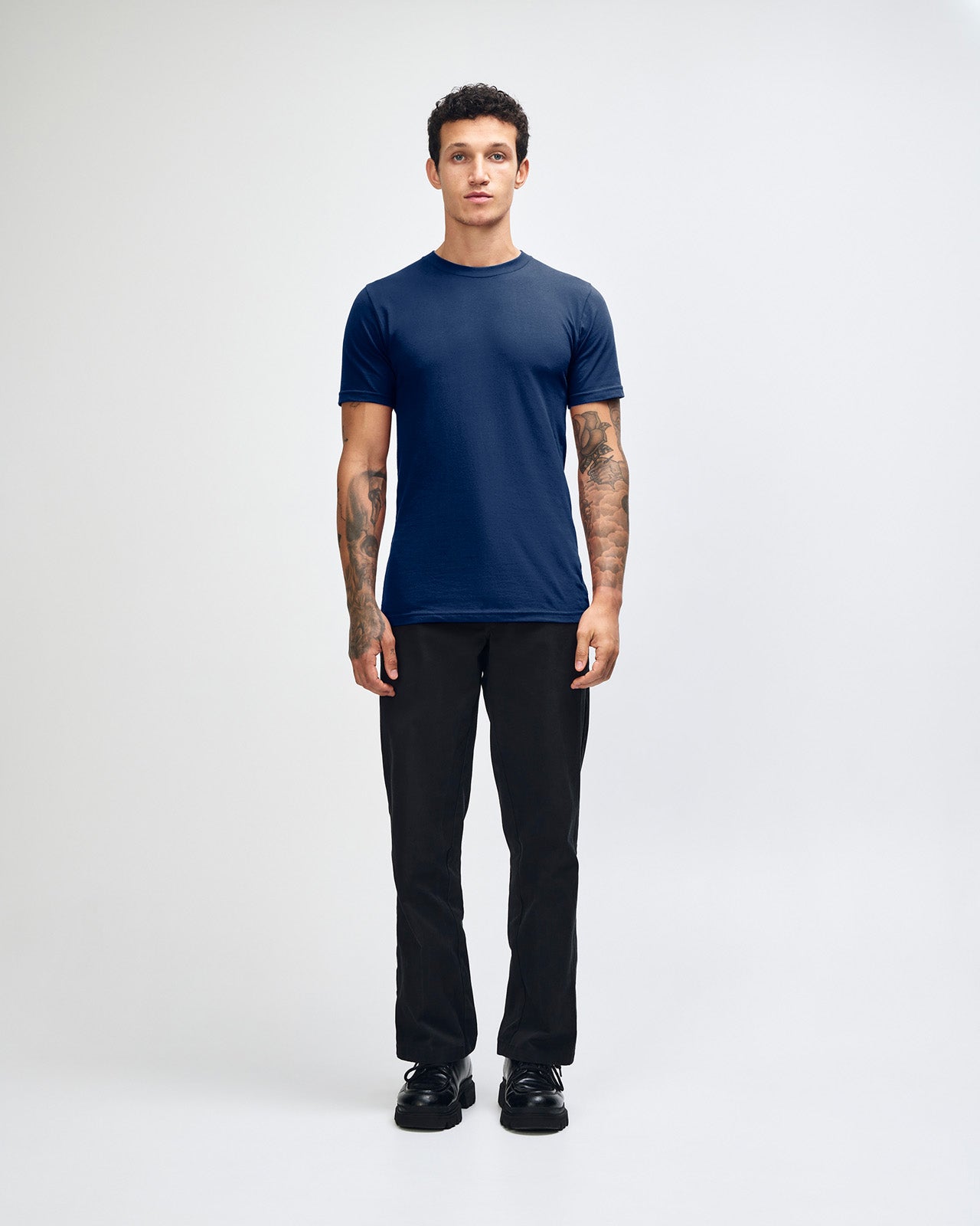 male model wearing  Navy colour Fine Jersey Unisex Crew Neck Tee (front pose) -navy