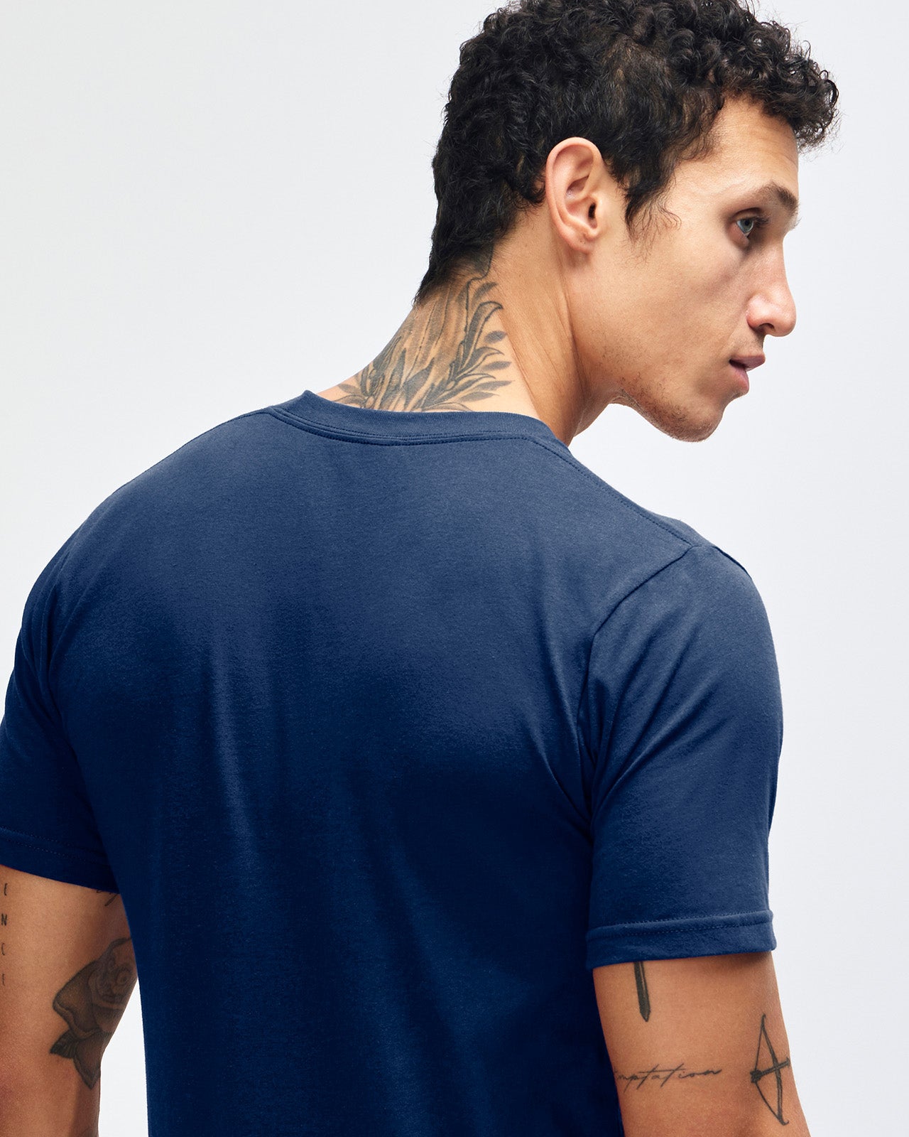 male model wearing  Navy colour Fine Jersey Unisex Crew Neck Tee (back pose) -navy