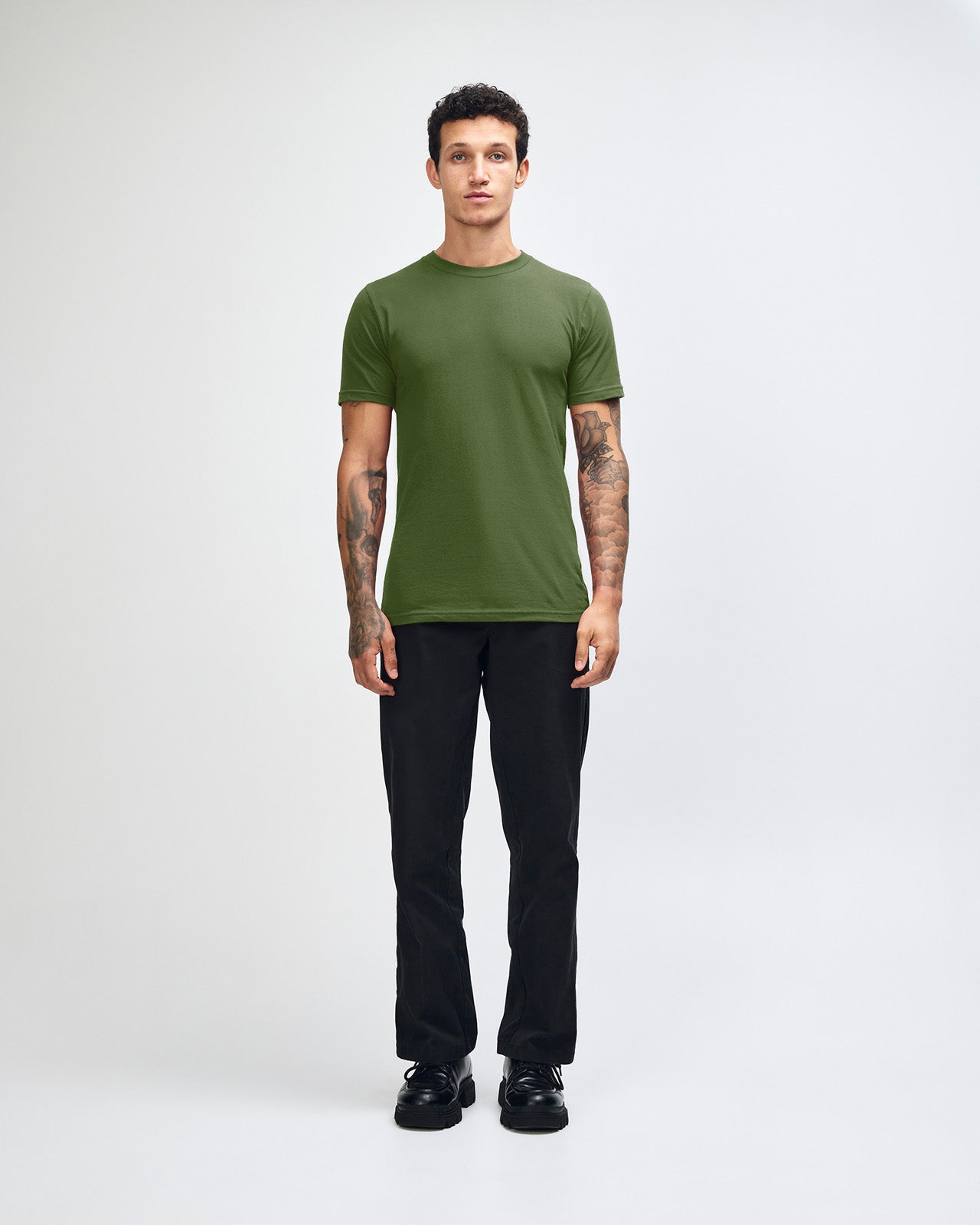 male model wearing  olive colour Fine Jersey Unisex Crew Neck Tee (front pose) -olive