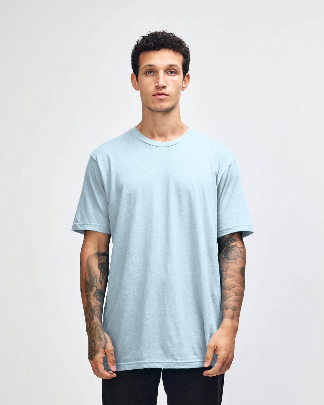 Male model wearing American Apparel Powder Blue Colour Fine Jersey Unisex Short Sleeve Crew Neck Tee (front pose) -powder blue 