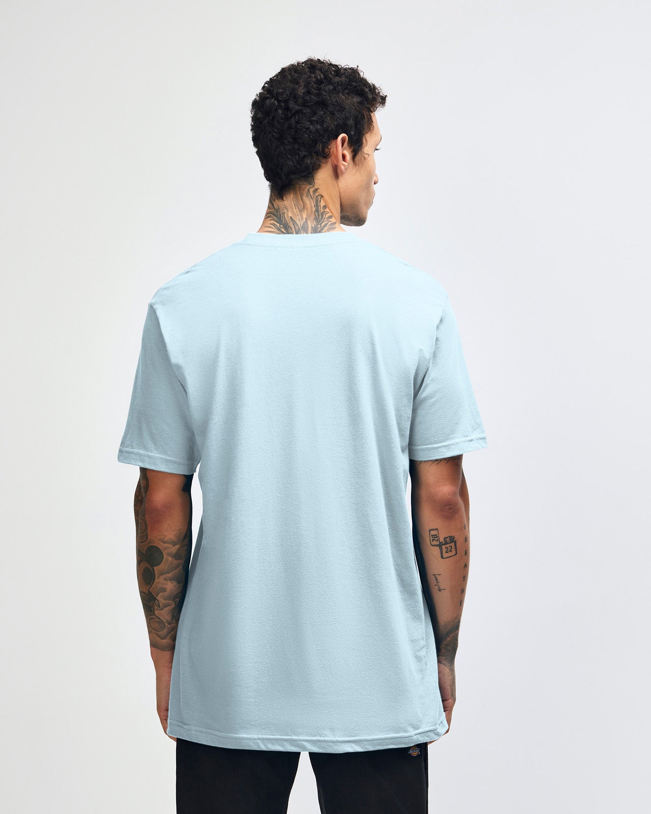 Male model wearing American Apparel Powder Blue Colour Fine Jersey Unisex Short Sleeve Crew Neck Tee (back pose) -powder blue 