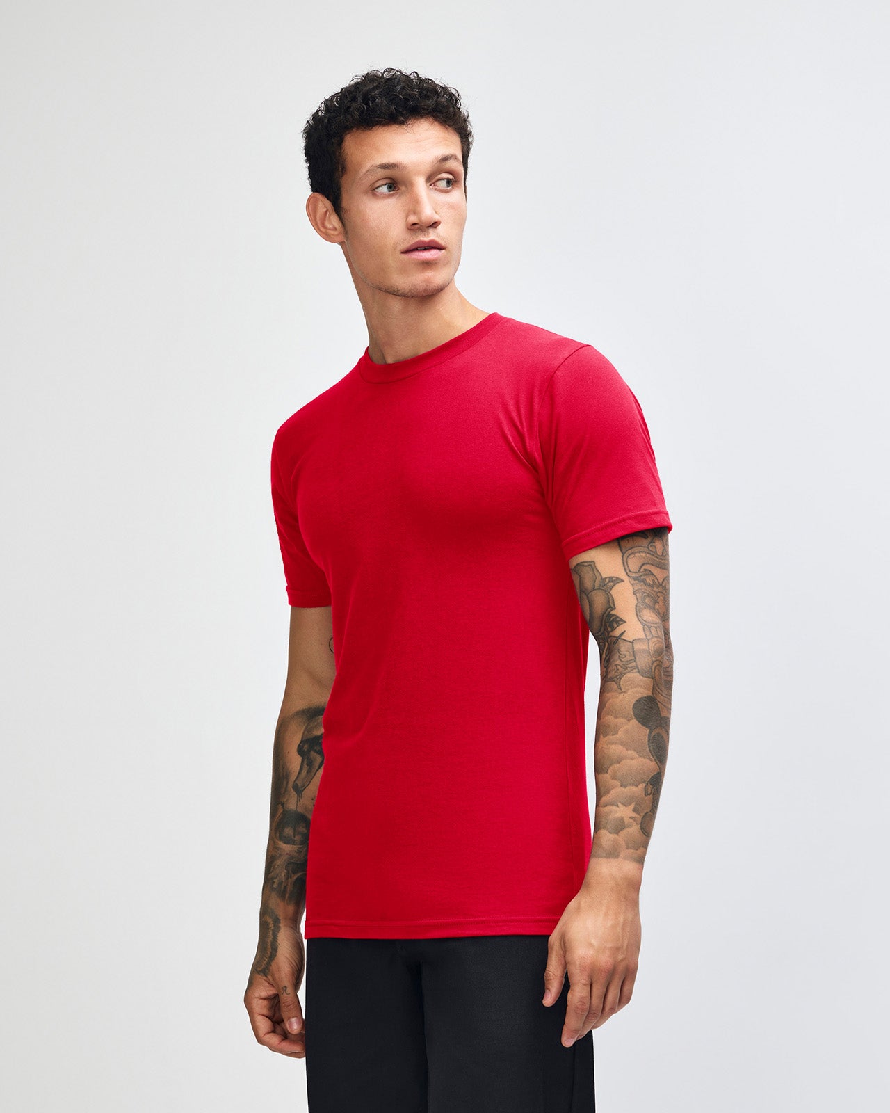 Male model wearing American Apparel Powder Red Colour Fine Jersey Unisex Short Sleeve Crew Neck Tee (front pose) -red