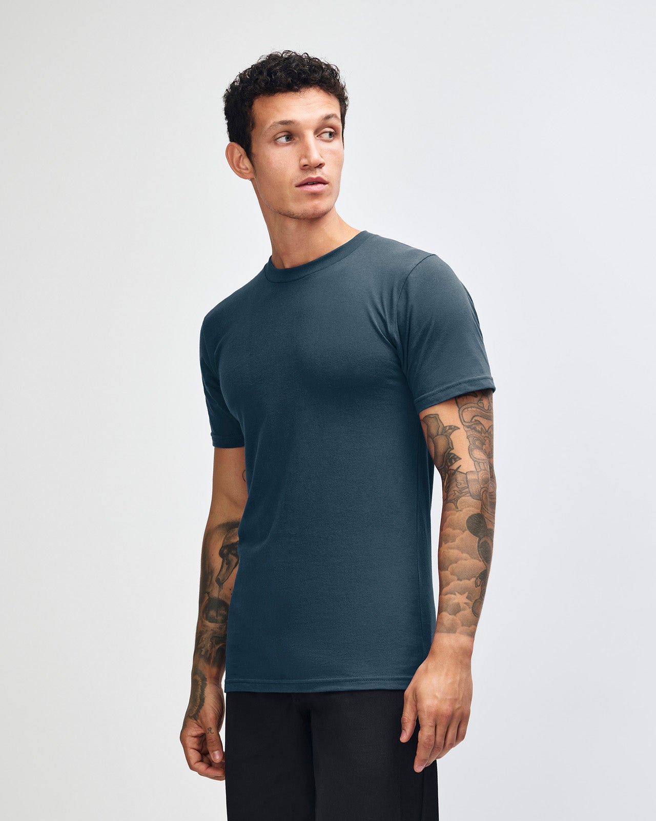 Male model wearing American Apparel Powder Sea Blue Colour Fine Jersey Unisex Short Sleeve Crew Neck Tee (front pose) -sea blue