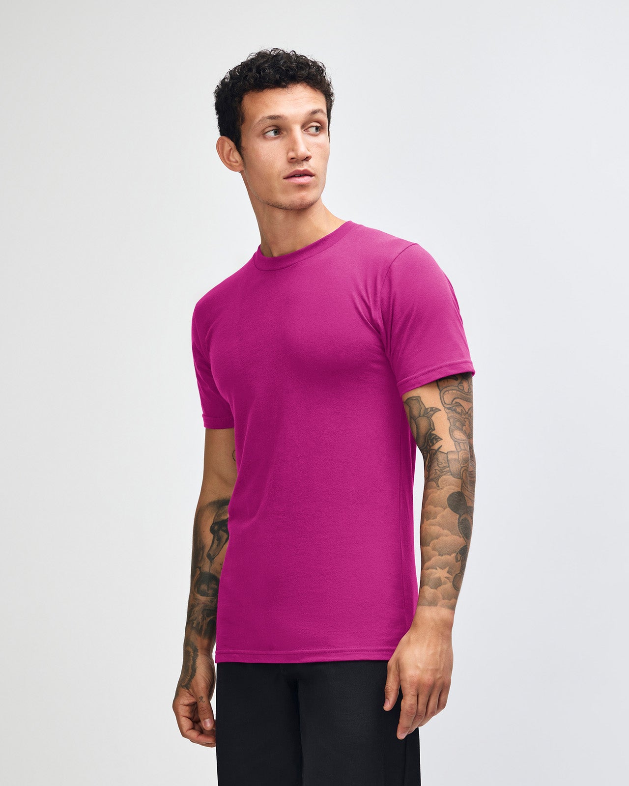 Male model wearing American Apparel Powder Super pink Colour Fine Jersey Unisex Short Sleeve Crew Neck Tee (front pose) -super pink 