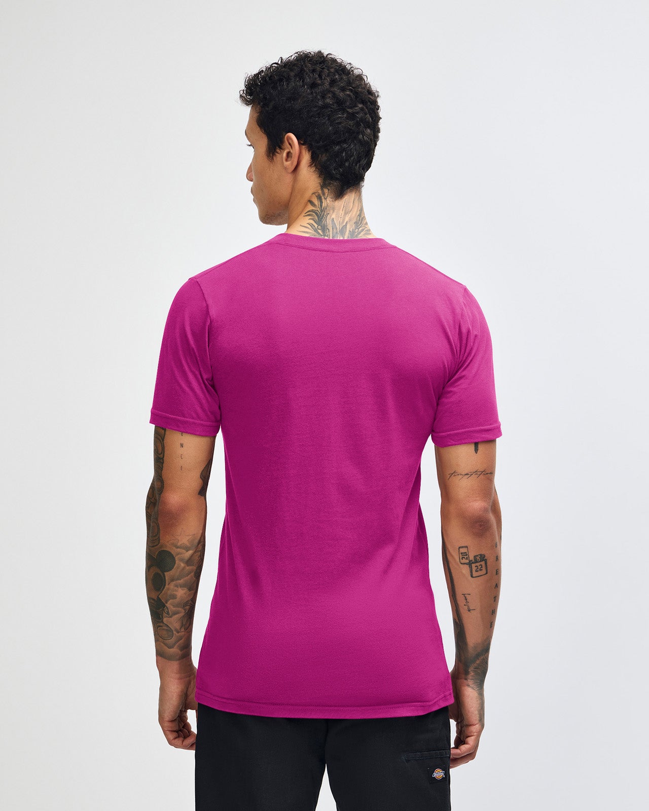 Male model wearing American Apparel Powder Super pink Colour Fine Jersey Unisex Short Sleeve Crew Neck Tee (back pose) -super pink 