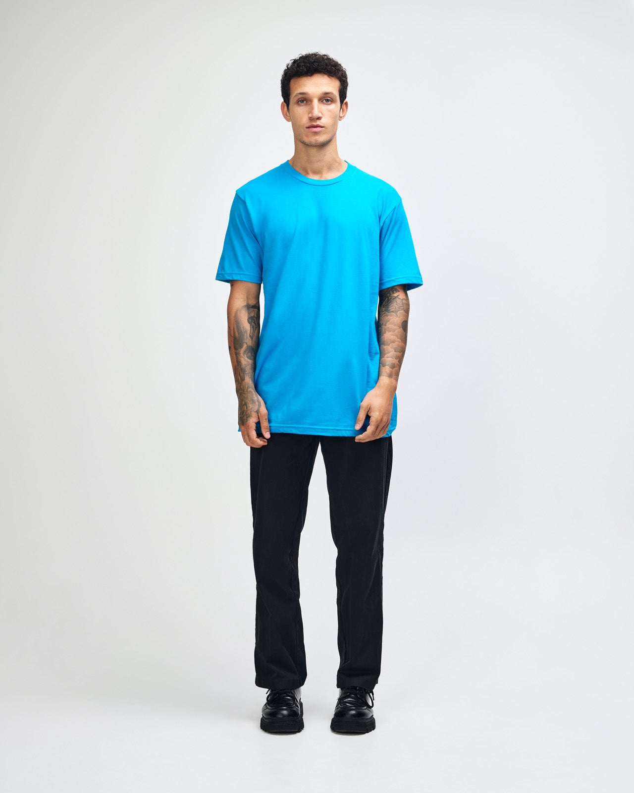 Male model wearing American Apparel Powder teal Colour Fine Jersey Unisex Short Sleeve Crew Neck Tee (front pose) -teal 