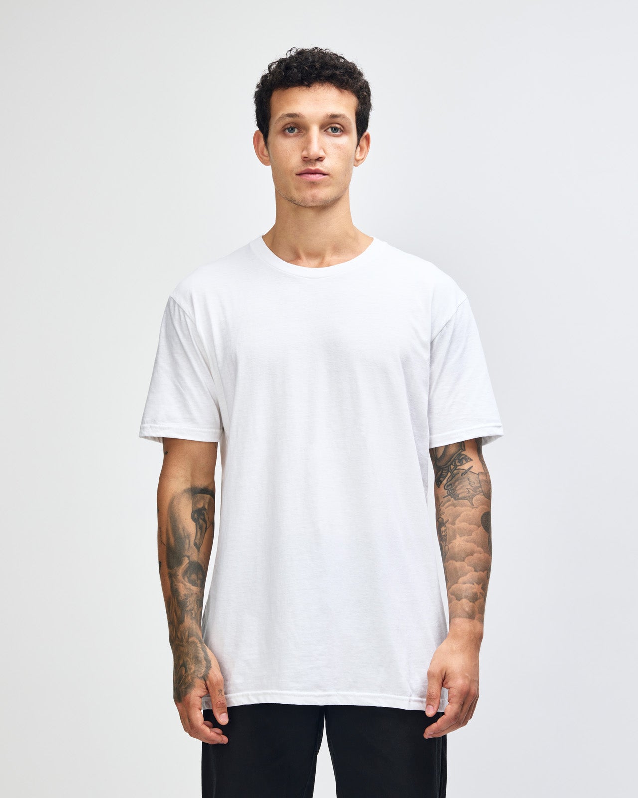 Male model wearing white colour CVC Unisex Short Sleeve Crew Neck Tee (front pose) -white